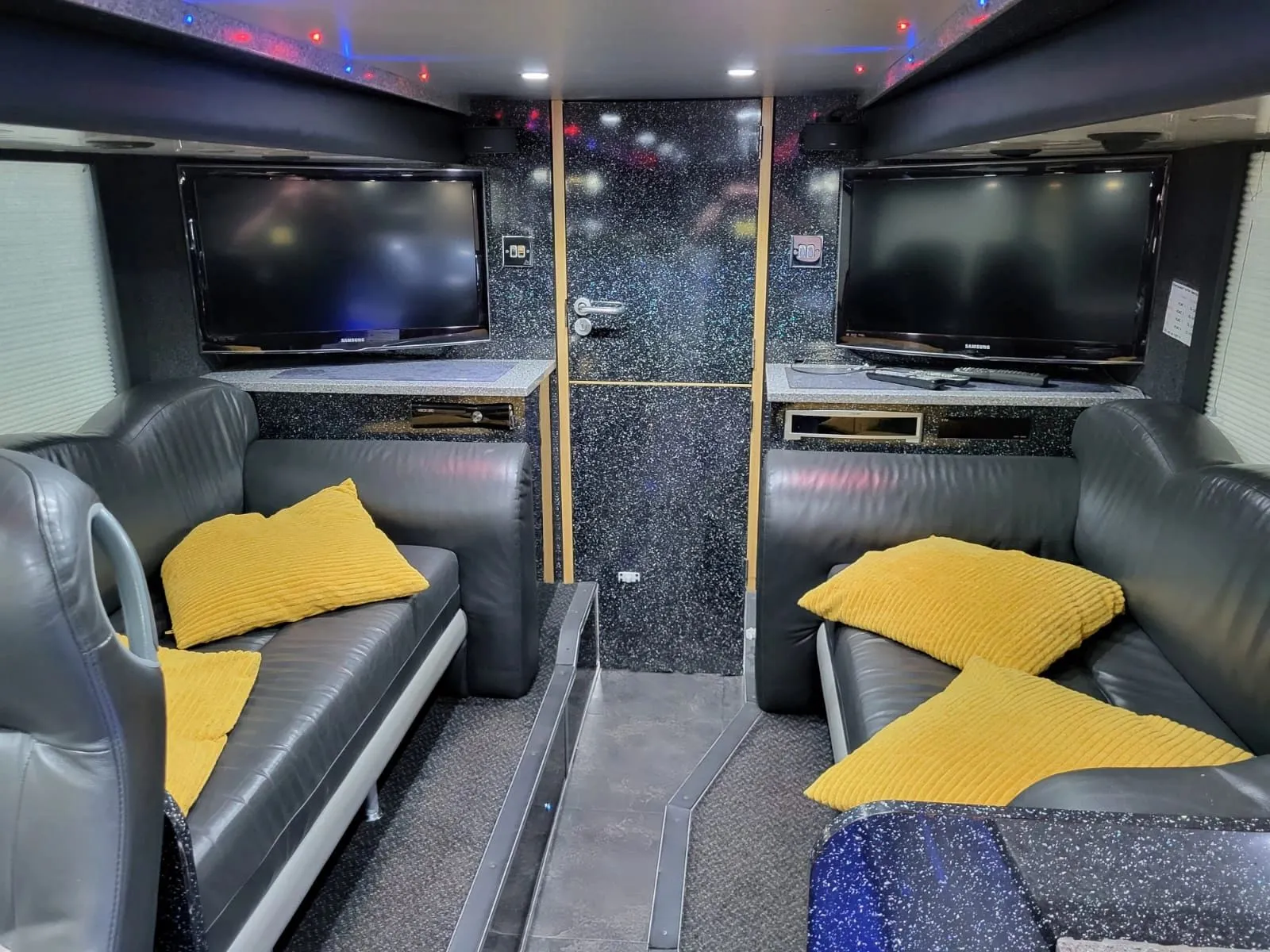 FTL nightliner entertainment lounge with leather sofas and Smart TVs
