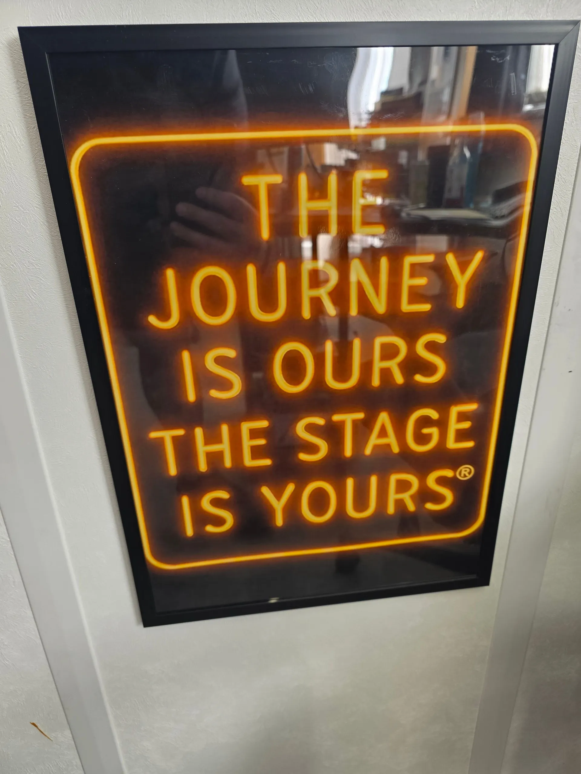 The journey is ours, the stage is yours neon sign inside an FTL bus